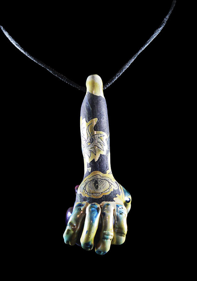 Hand holding purple skull made by Phil Sundling and Glass Scribe