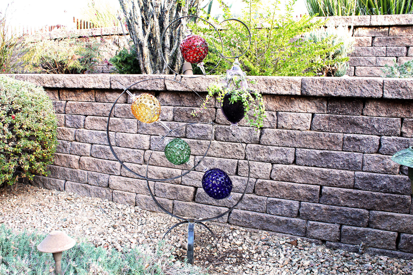 4 Ring metal and borosilicate glass garden sculpture