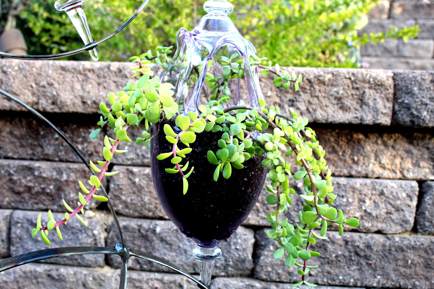 4 Ring metal and borosilicate glass garden sculpture
