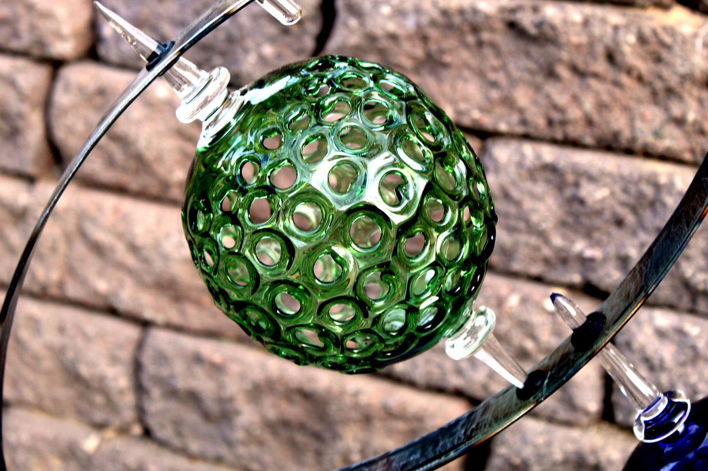 4 Ring metal and borosilicate glass garden sculpture