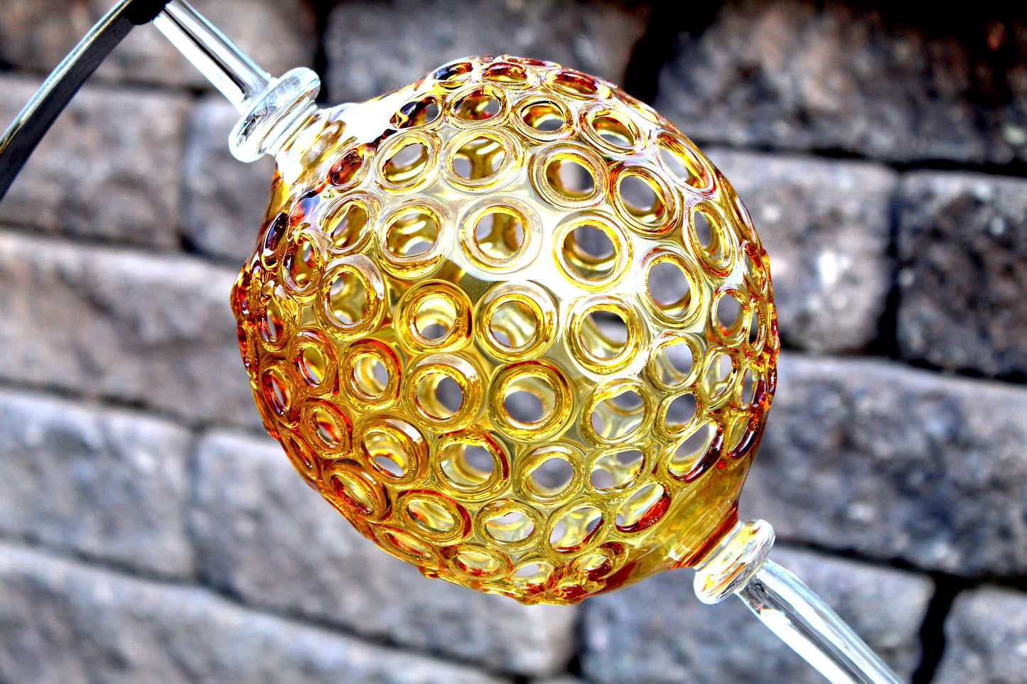 4 Ring metal and borosilicate glass garden sculpture