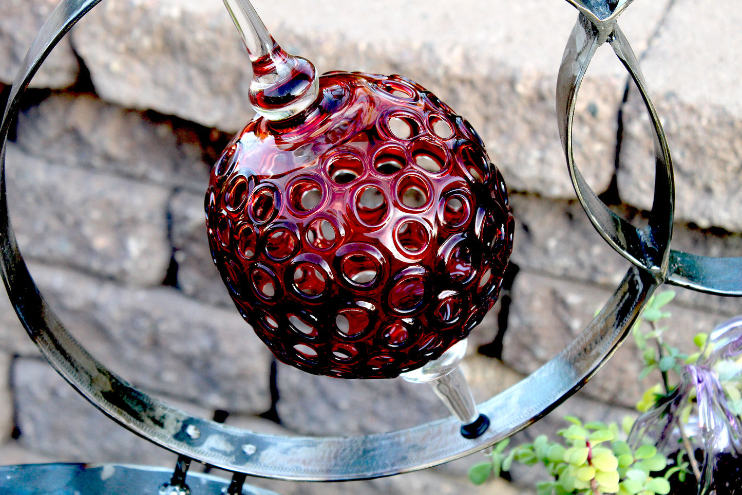 4 Ring metal and borosilicate glass garden sculpture