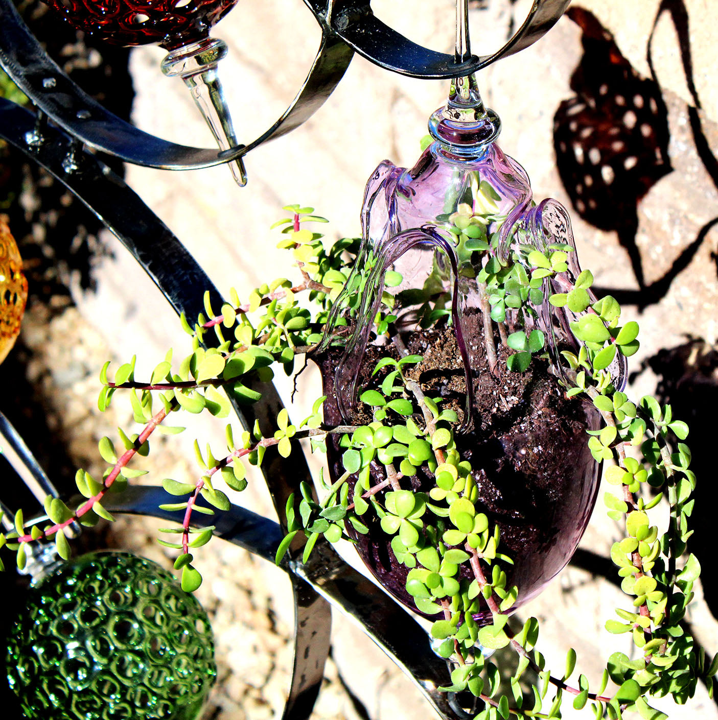 4 Ring metal and borosilicate glass garden sculpture