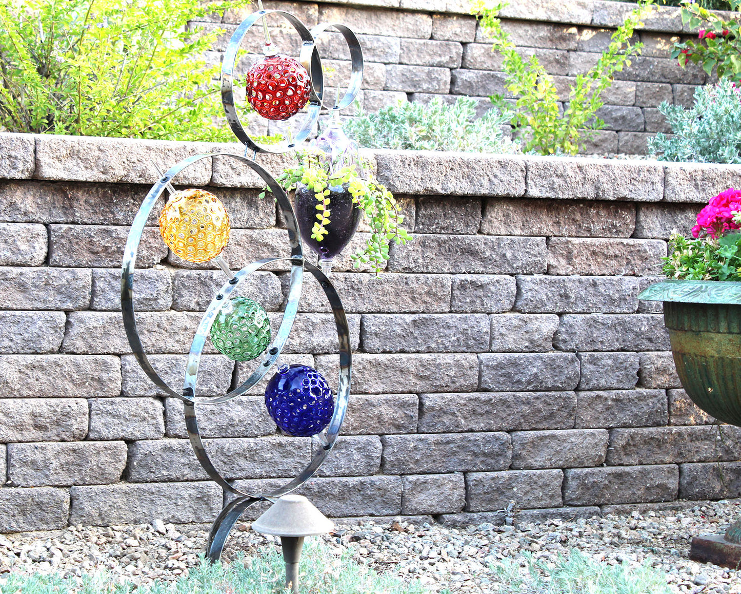 4 Ring metal and borosilicate glass garden sculpture