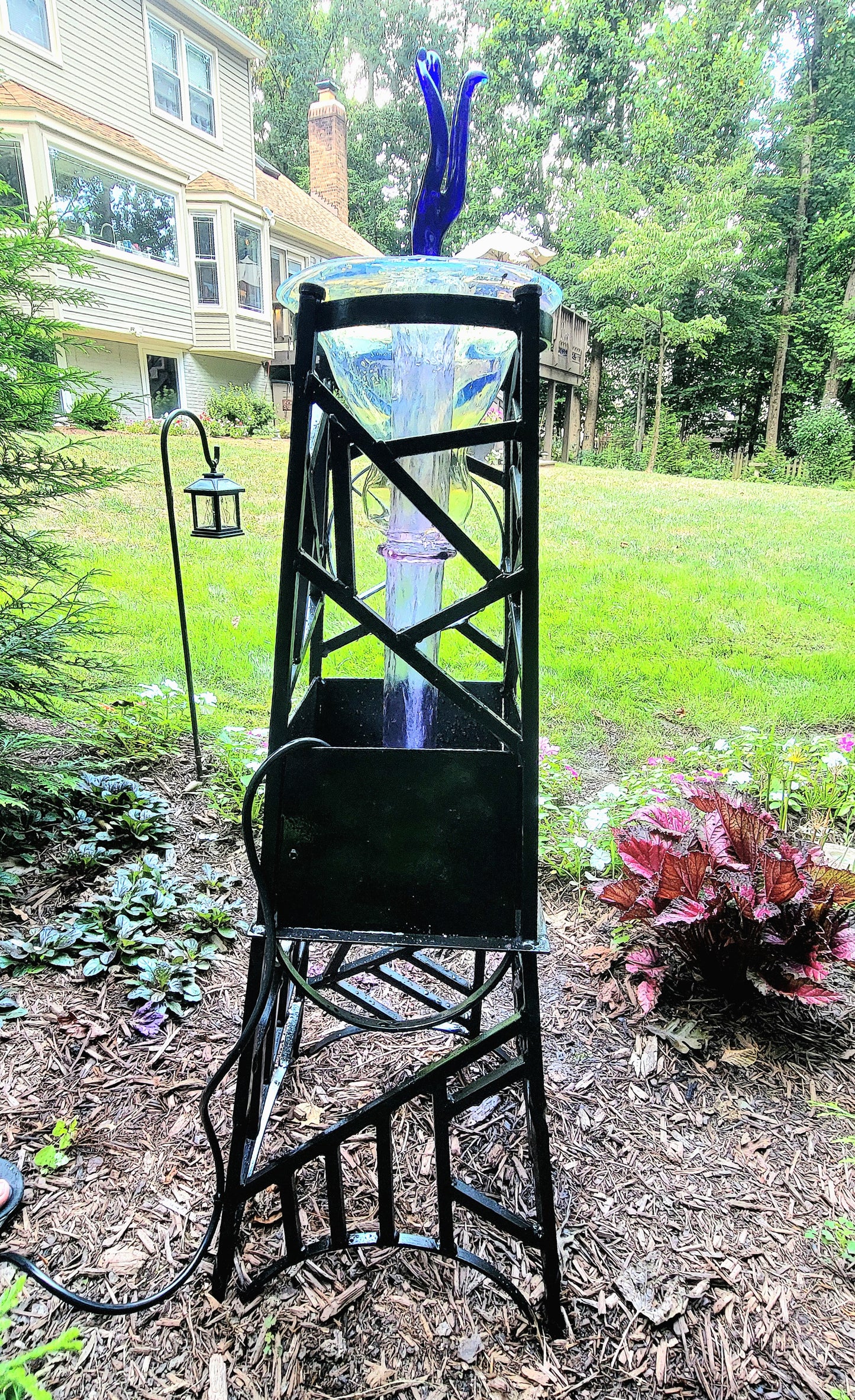Steel and borosilicate garden fountain