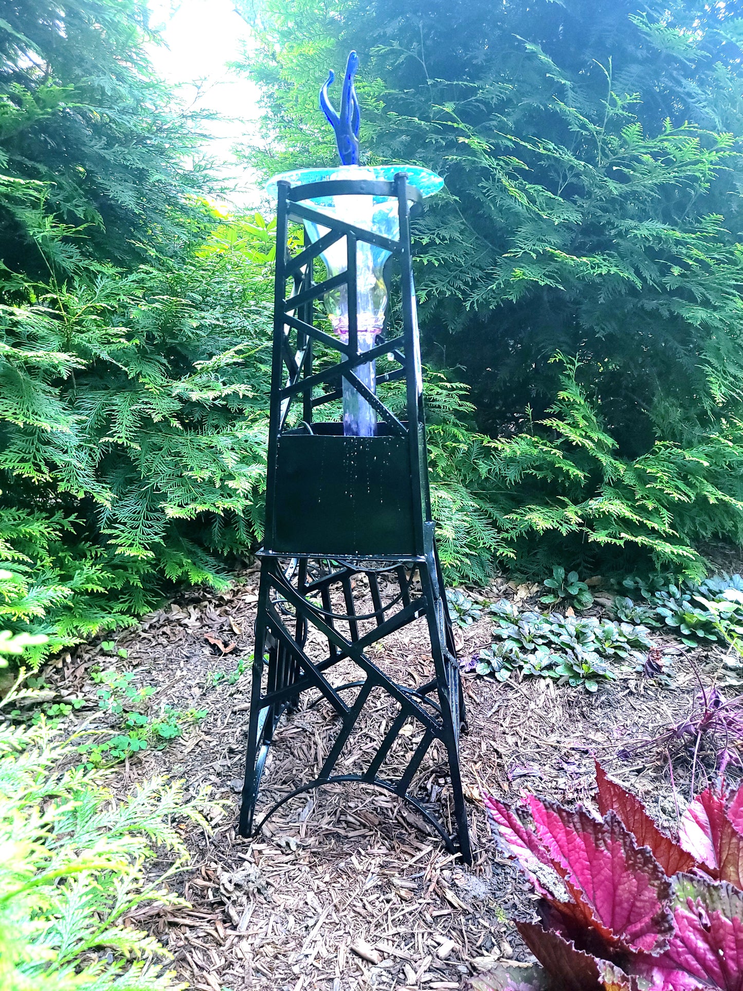 Steel and borosilicate garden fountain