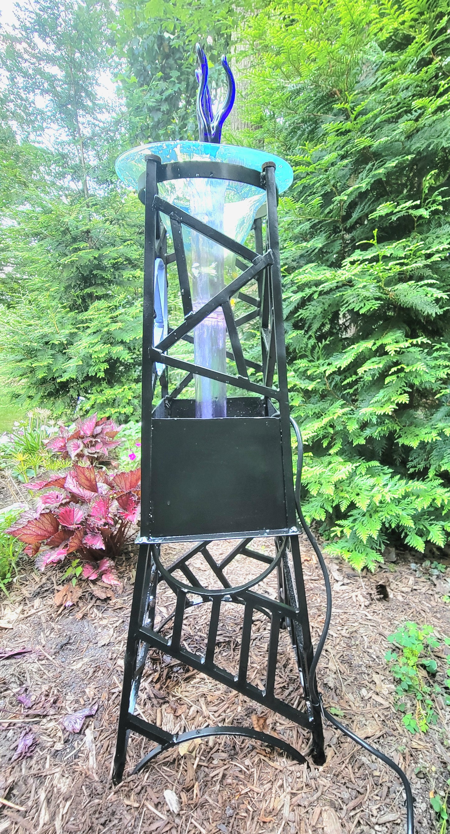 Steel and borosilicate garden fountain