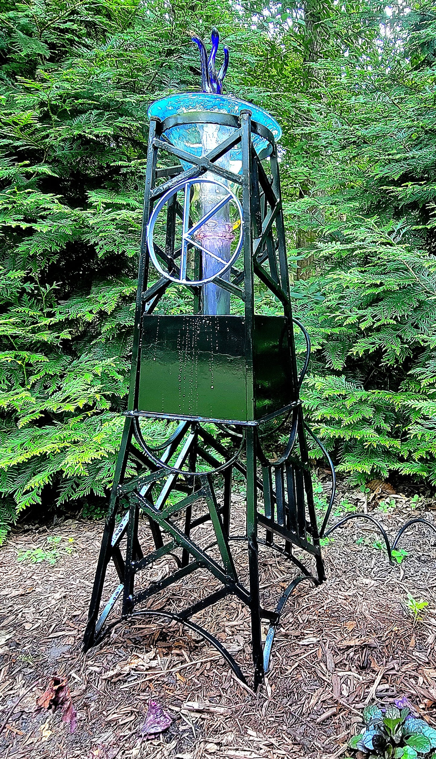 Steel and borosilicate garden fountain
