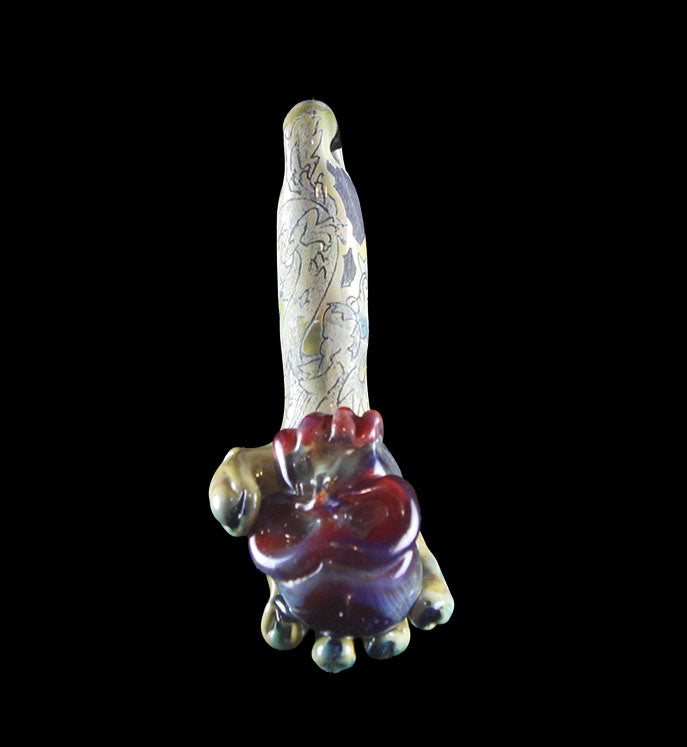 Hand holding purple skull made by Phil Sundling and Glass Scribe