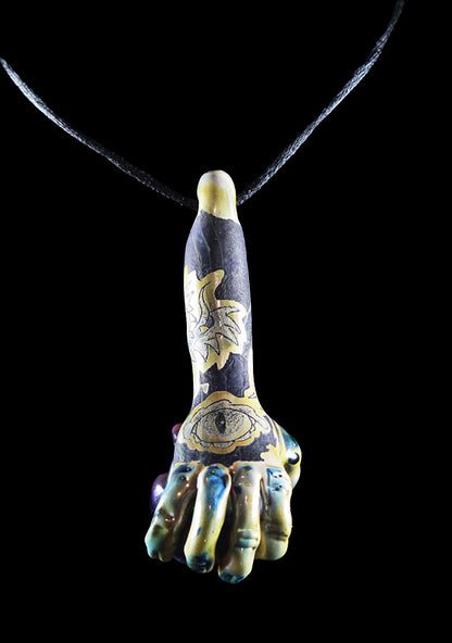 Hand holding purple skull made by Phil Sundling and Glass Scribe