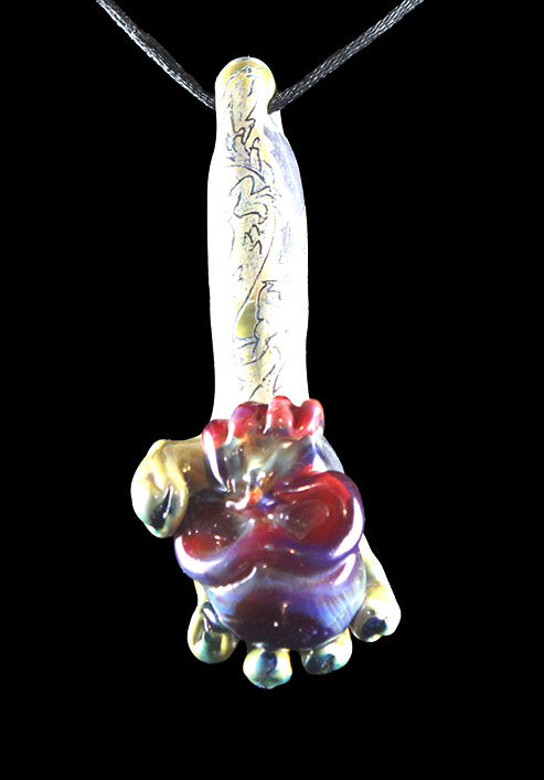 Hand holding purple skull made by Phil Sundling and Glass Scribe