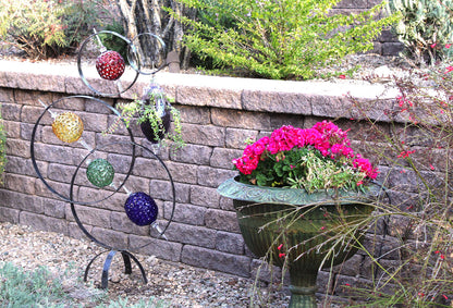 4 Ring metal and borosilicate glass garden sculpture