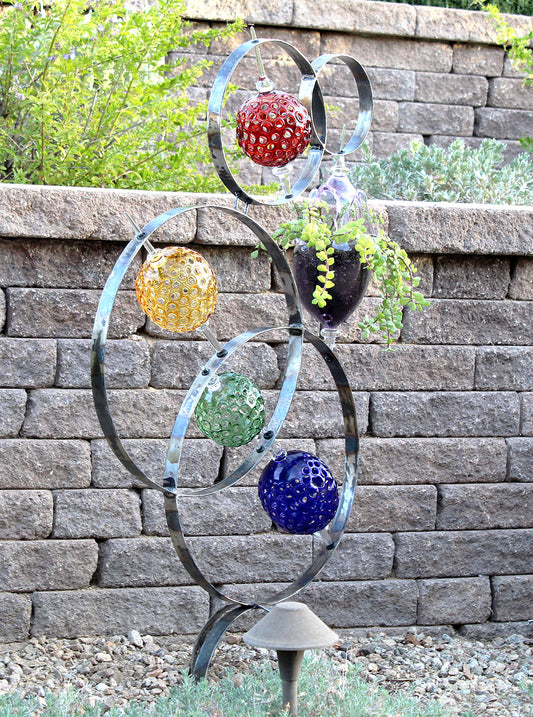 4 Ring metal and borosilicate glass garden sculpture