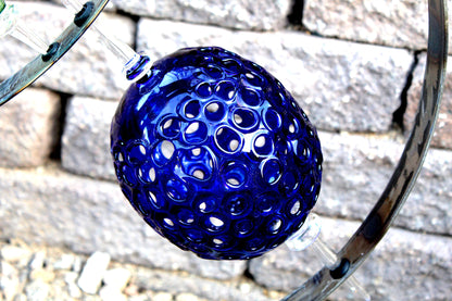 4 Ring metal and borosilicate glass garden sculpture