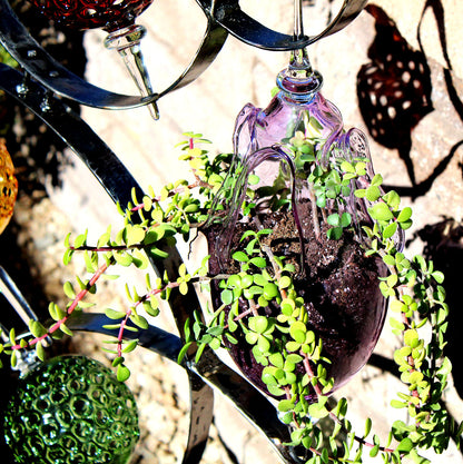 4 Ring metal and borosilicate glass garden sculpture