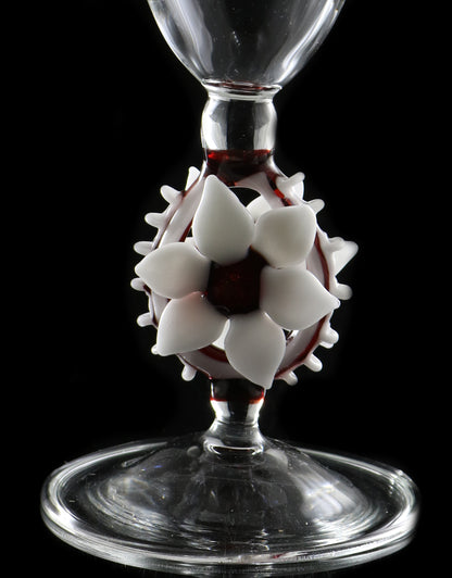 Clear vase with white flower and red accents by, Phil Sundling