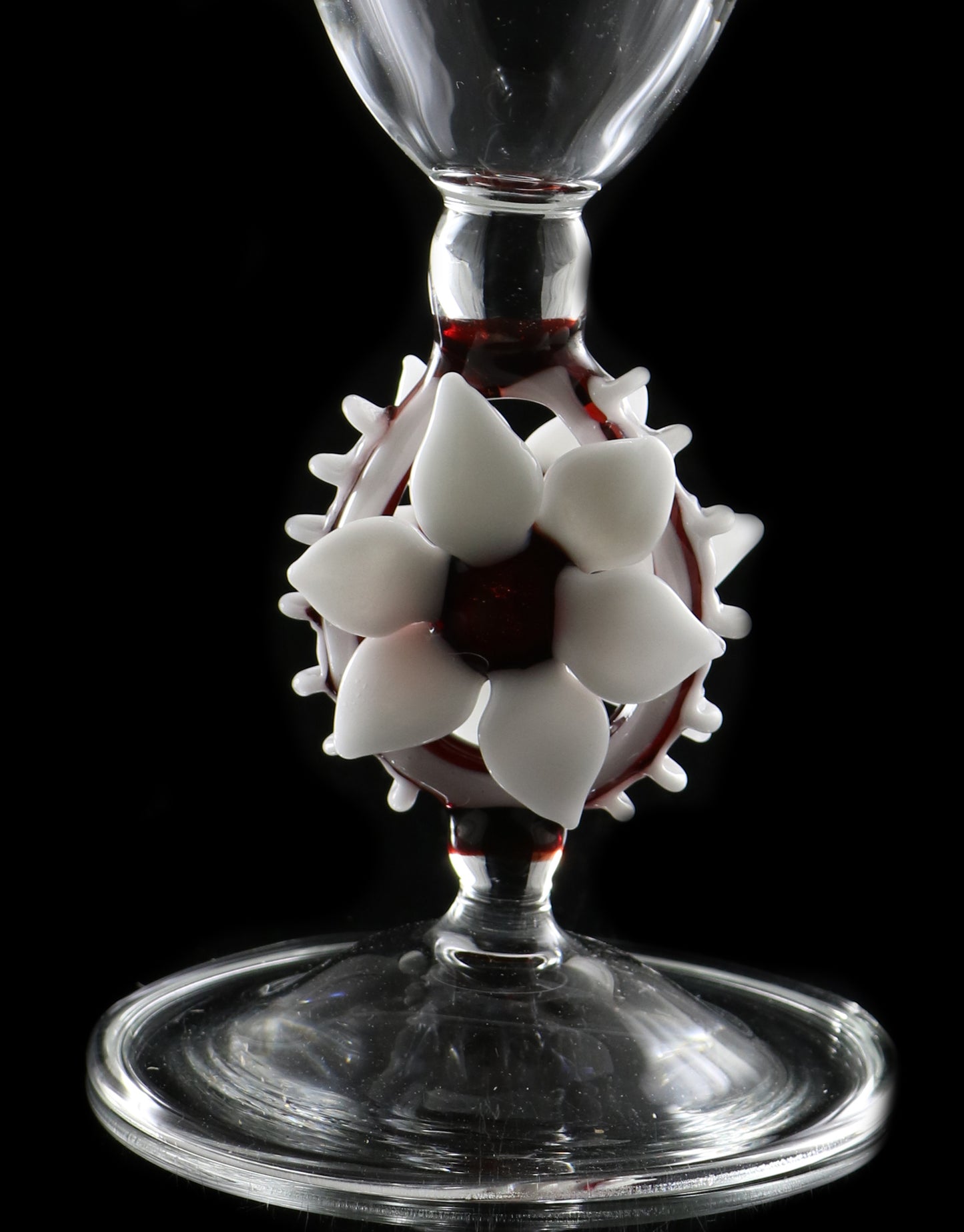 Clear vase with white flower and red accents by, Phil Sundling