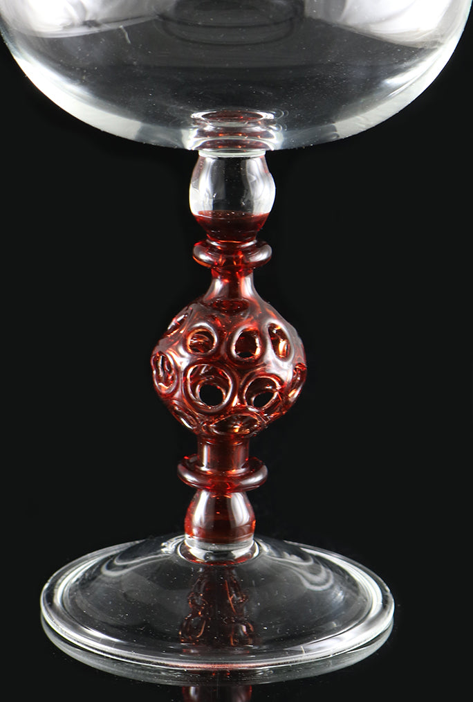 clear vase with red stem by, Phil Sundling